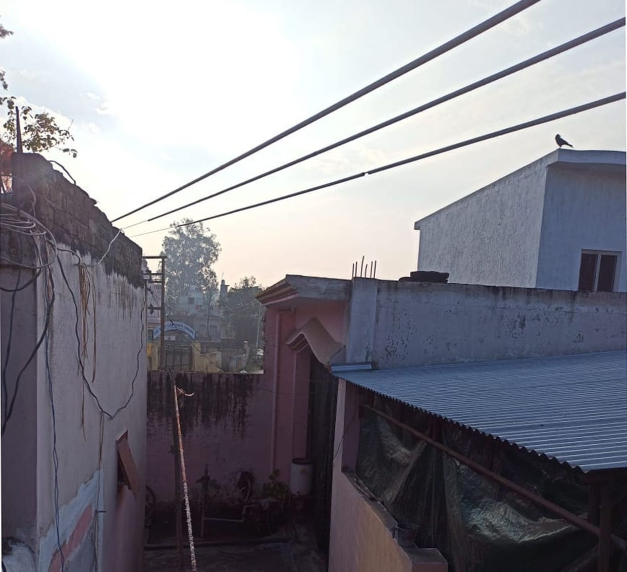 If it is swinging somewhere, then the HT line is passing above the houses.