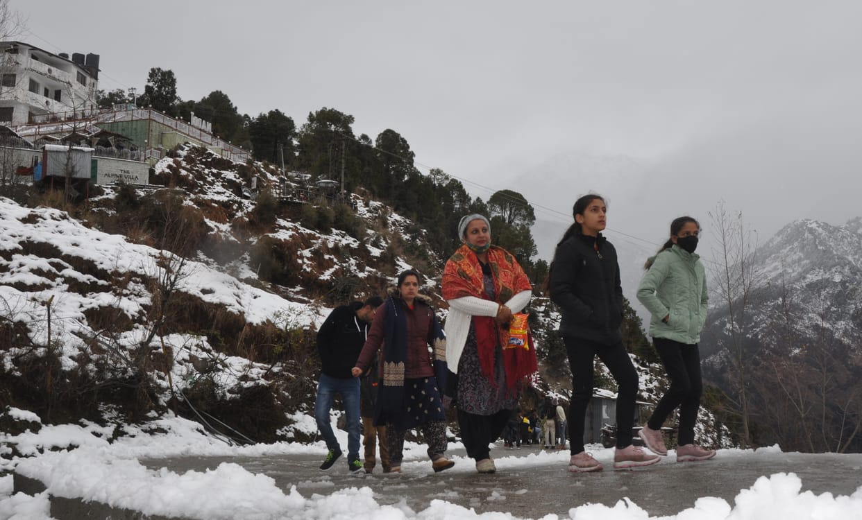 Tourists gathered in Naddi on the first snowfall of the year