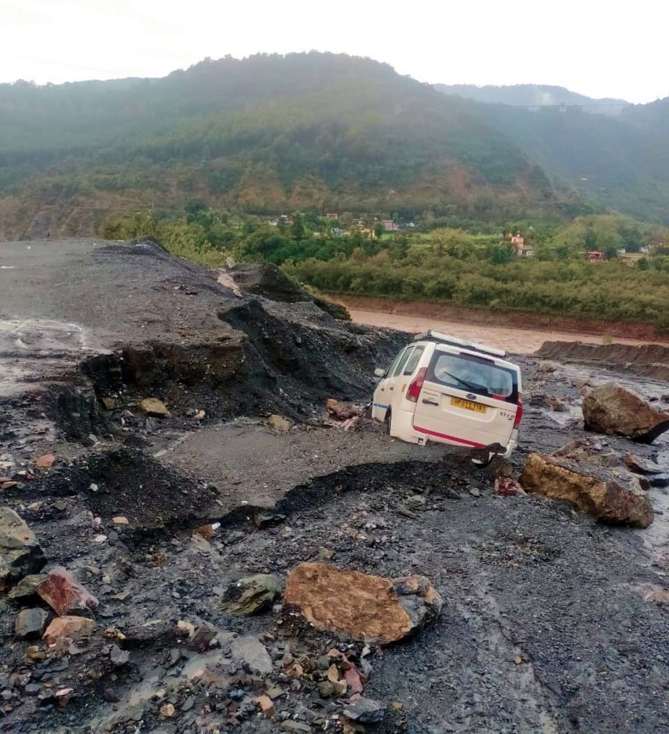 passangers rescue by running as car struck in land slides