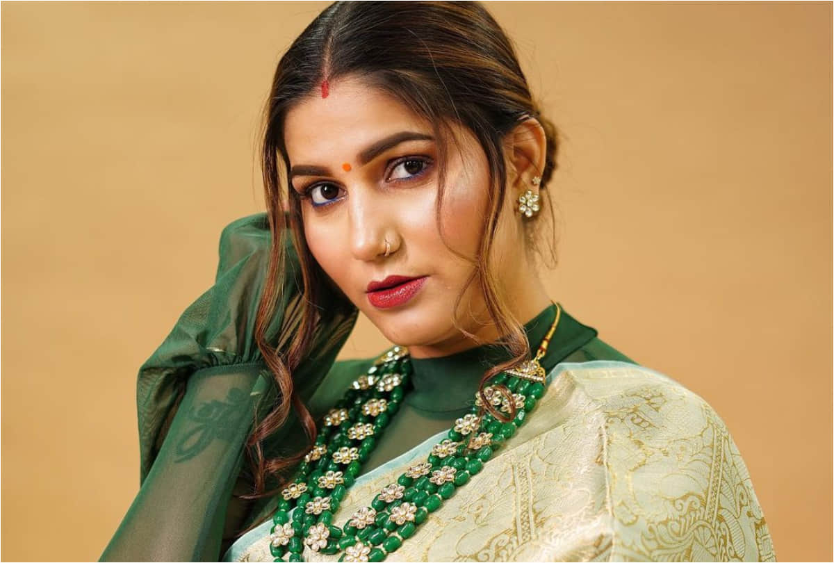 sapna choudhary green orange saree look stunning