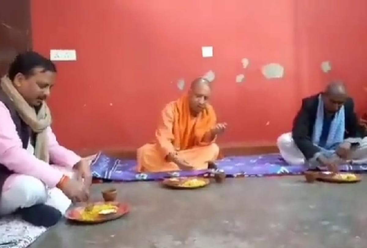 CM Yogi Adityanath eating food on Dalit Amritlal Bharti residence in Gorakhpur