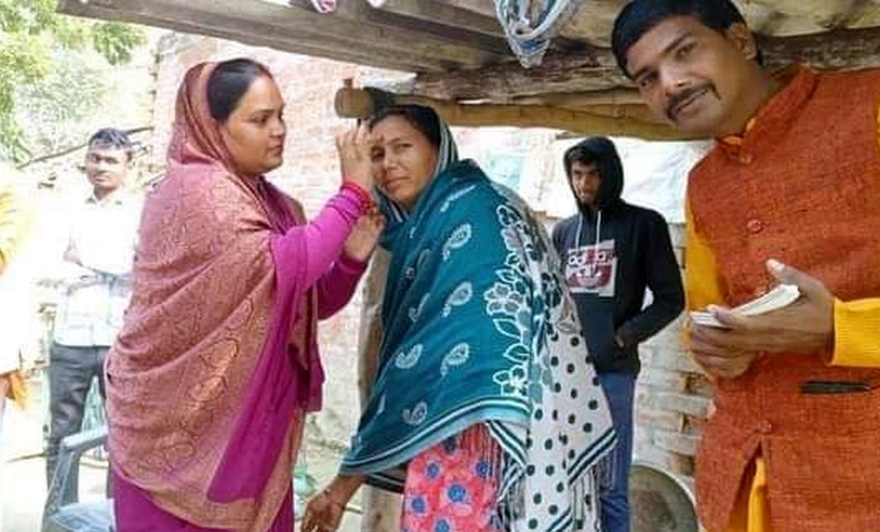 After reaching the village, the MLA applied tilak to the beneficiaries
