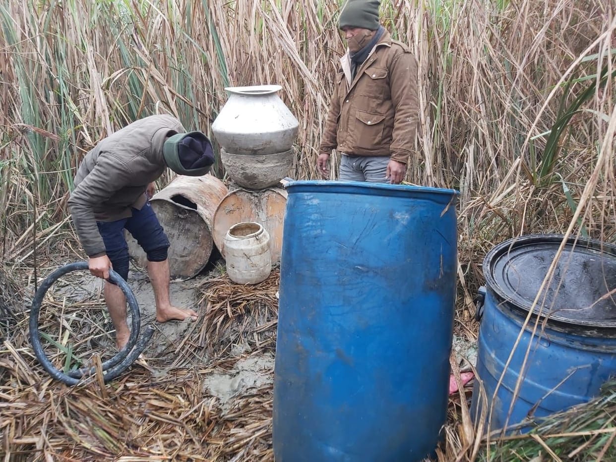 Five arrested for making raw liquor, two absconding
