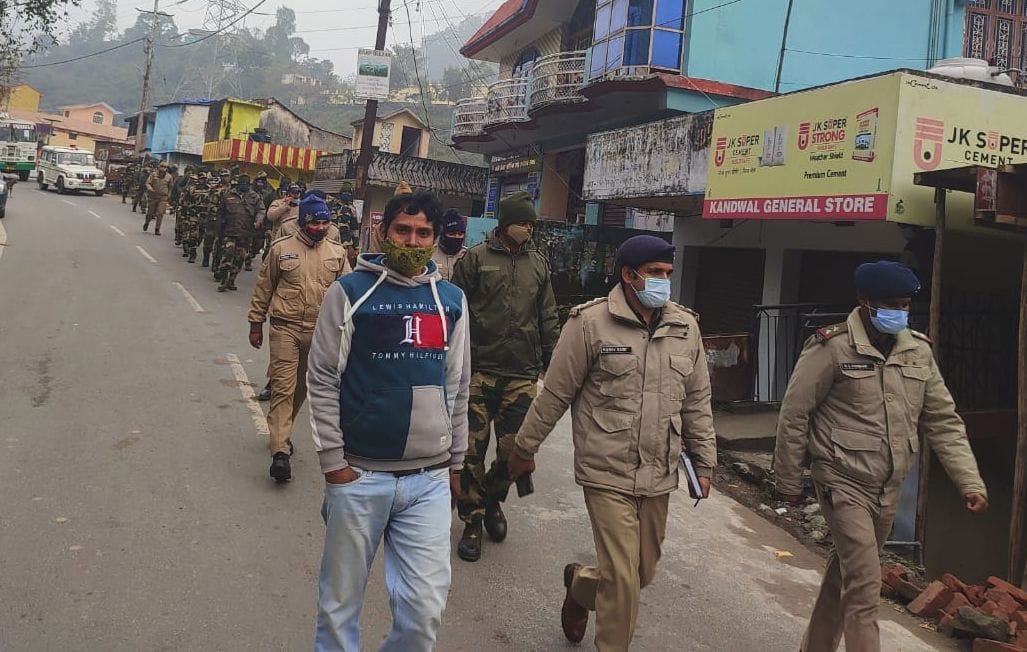 Police and BSF personnel took out flag march
