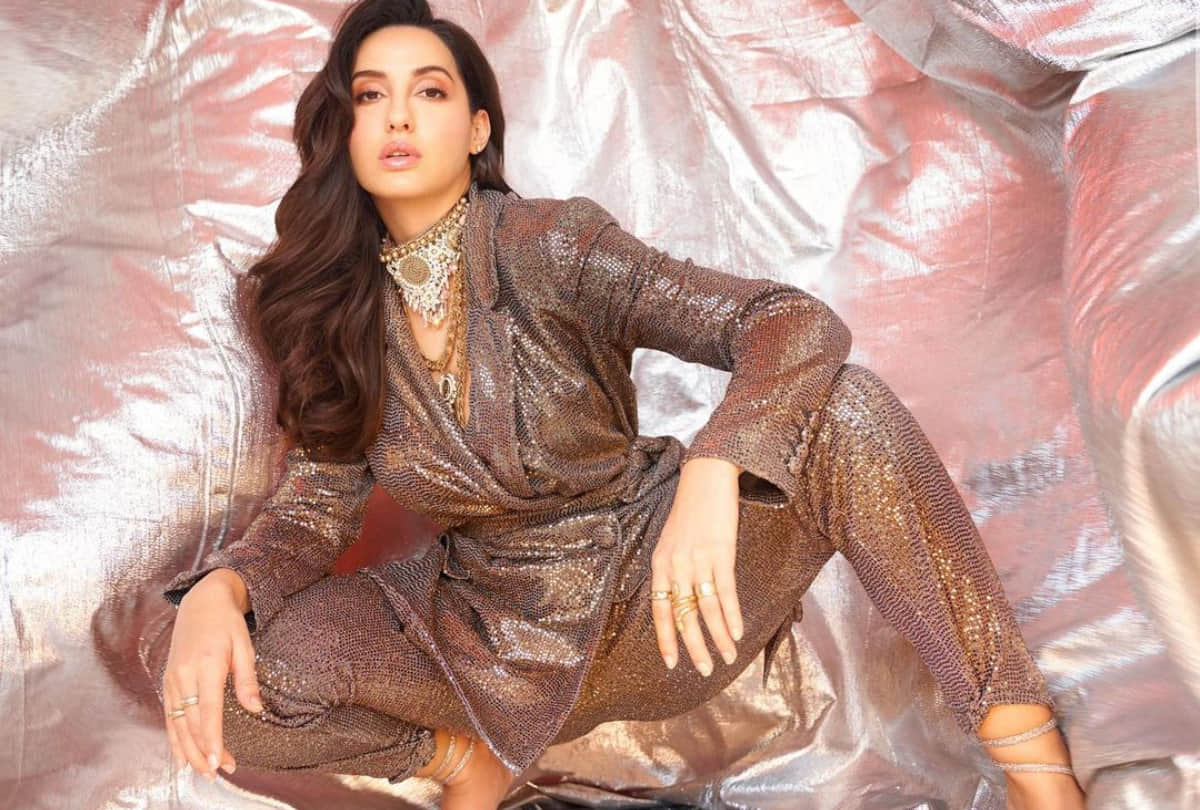 nora fatehi late post on birthday celebration in golden loose fitting dress