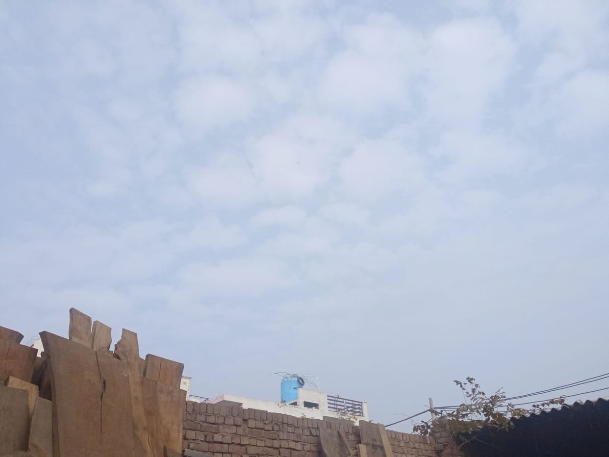 Clouds in the sky, 0.2 degree drop in minimum temperature