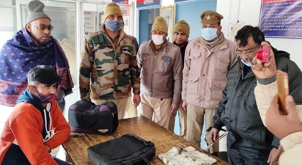 20 lakh rupees recovered from two luxury cars