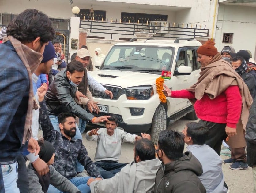Brahmin youth lying in front of SP District President's car