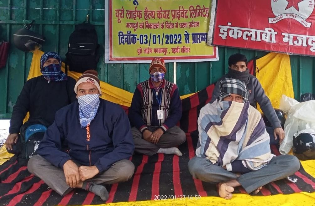 Employees protest after being fired from the factory