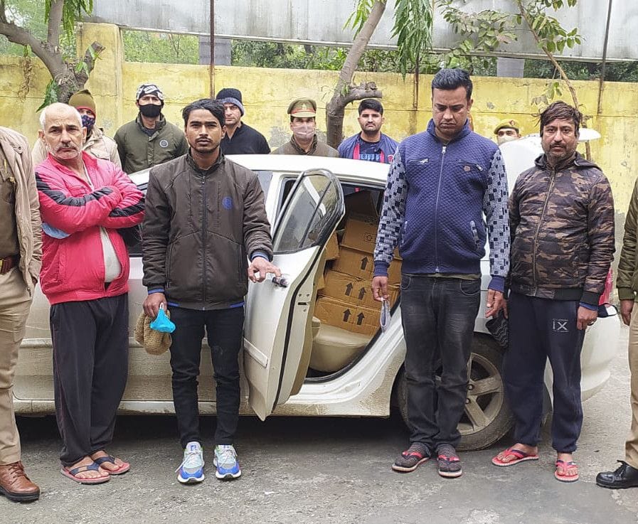 Four arrested with 32 boxes of liquor