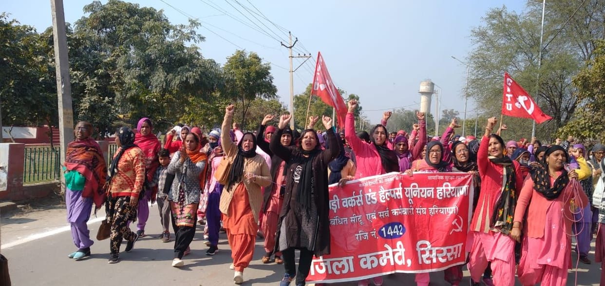 Anganwadi workers demonstrated by wearing black sardines