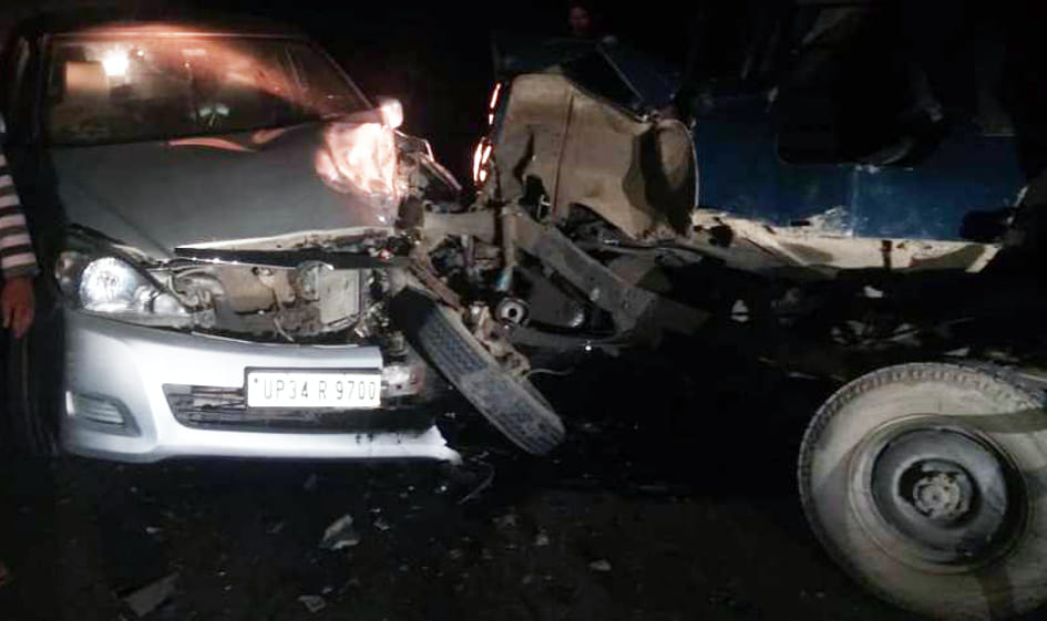 Truck collides with car, four injured