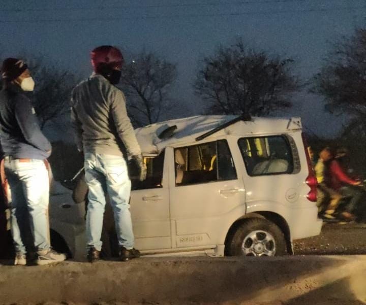 The car overturned after colliding with the divider, former minister and driver injured