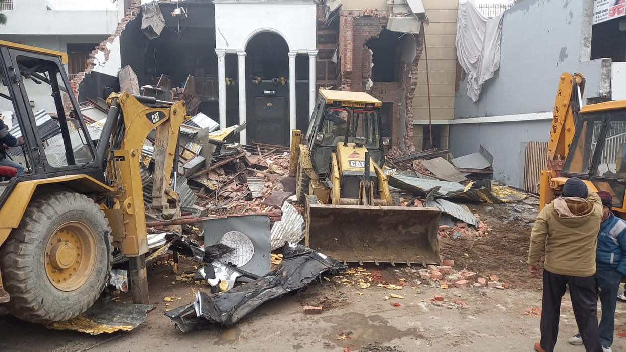 Bulldozer of BDA ran on bar of liquor mafia report was filed calling construction illegal
