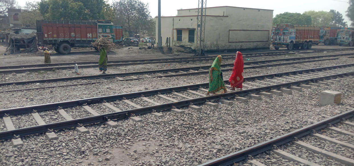 crossing railway track keeping life on palm
