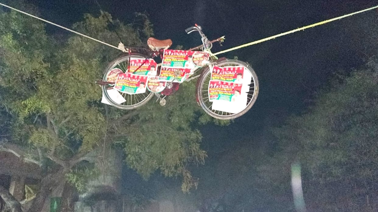 cycle hanging on the road for election campaign in etah