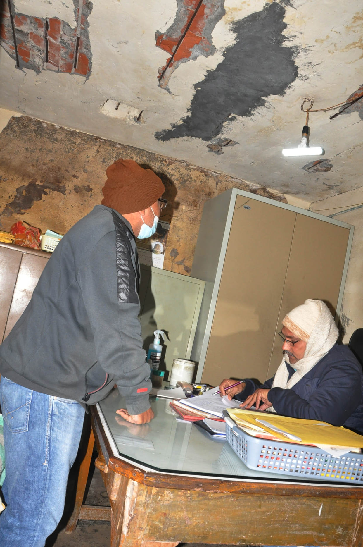 Health workers working in dilapidated buildings