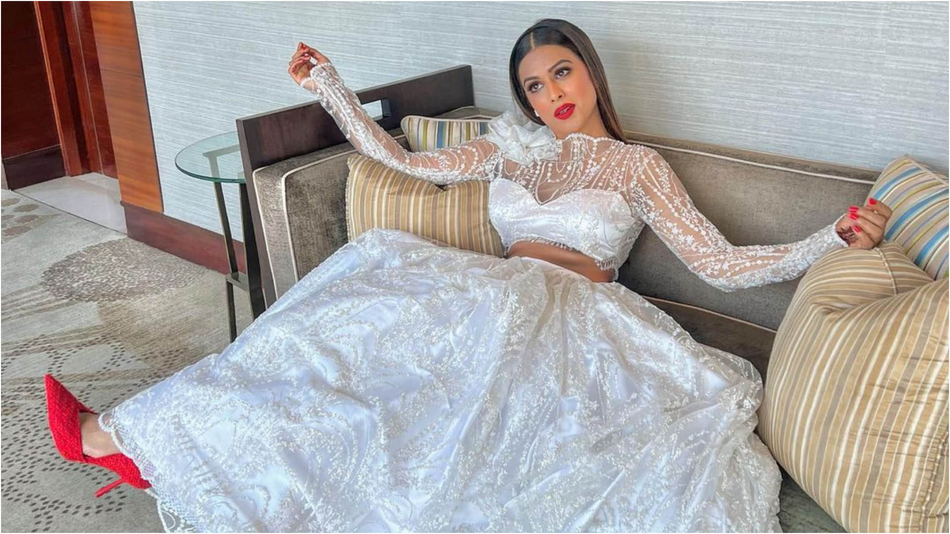 nia sharma gorgeous white lehenga in brother wedding look stunning