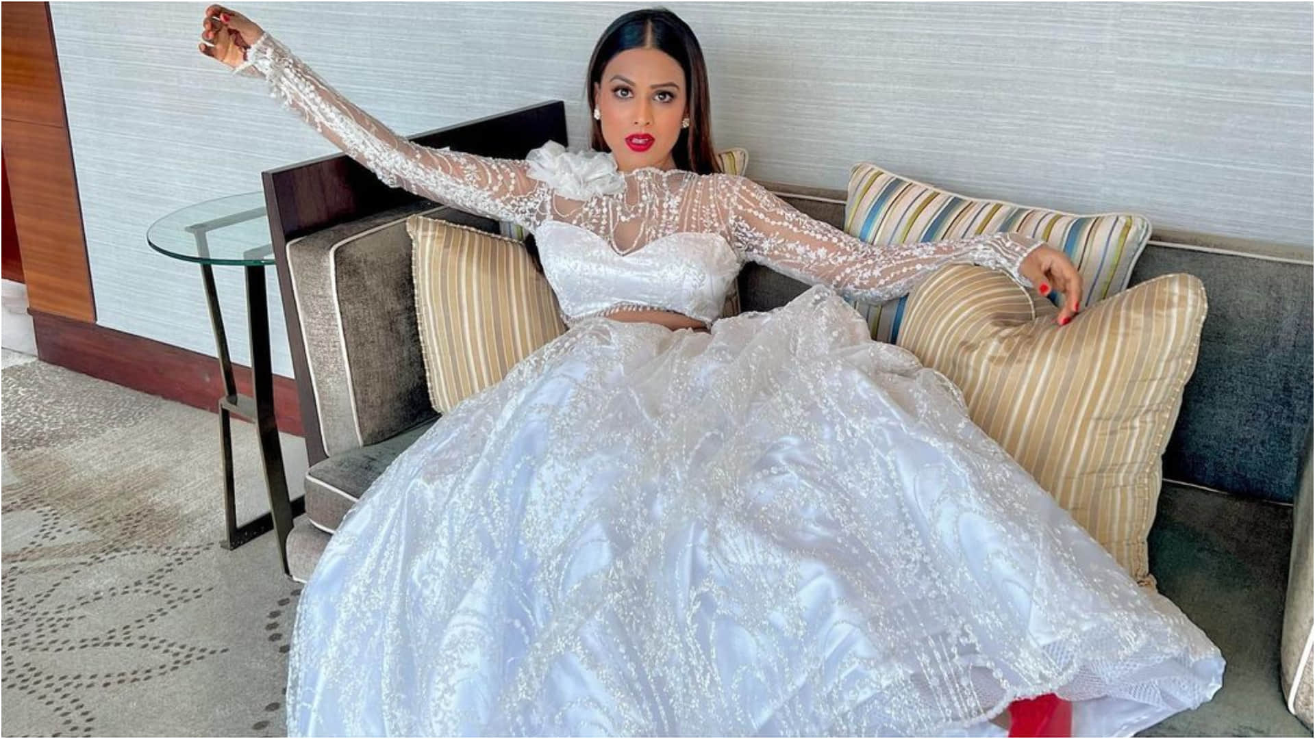 nia sharma gorgeous white lehenga in brother wedding look stunning