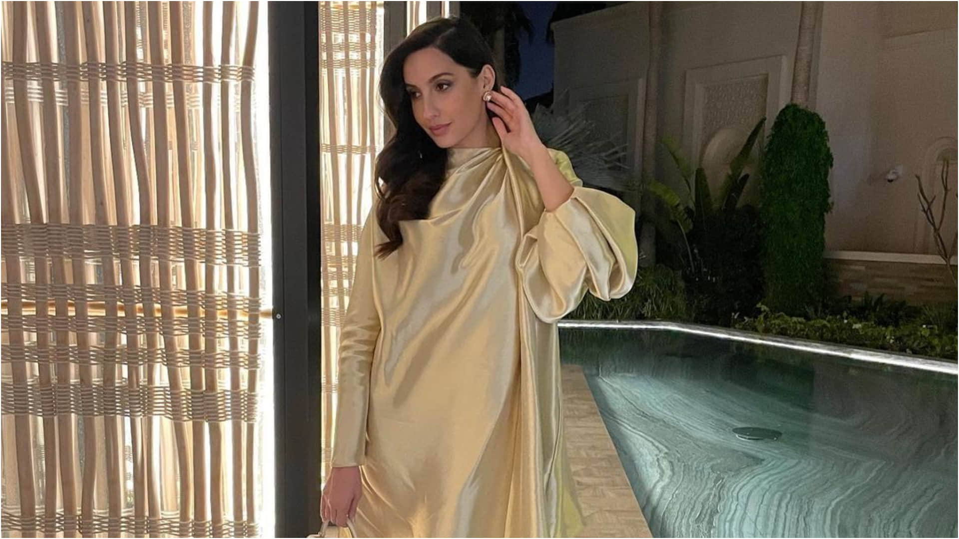 nora fatehi late post on birthday celebration in golden loose fitting dress