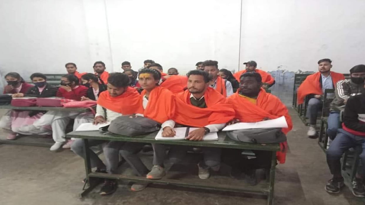 Hijab controversy Aligarh students study wearing saffron warn not to allow Islamization of education