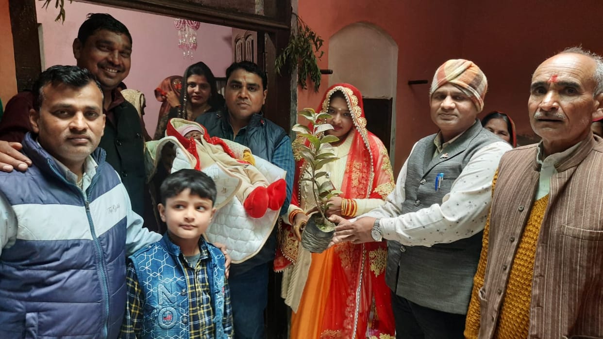 Presented a plant to the child in the naming ceremony