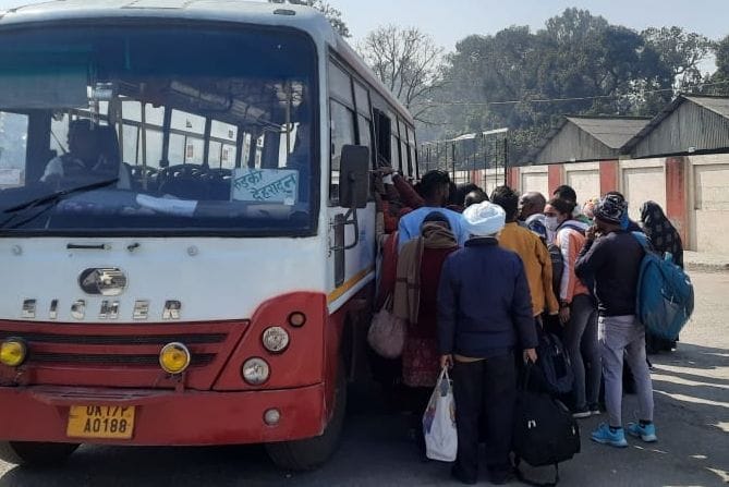 Crowd of passengers is huge, waiting for buses at the depot