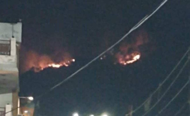 Fire on the hill of Mansa Devi temple
