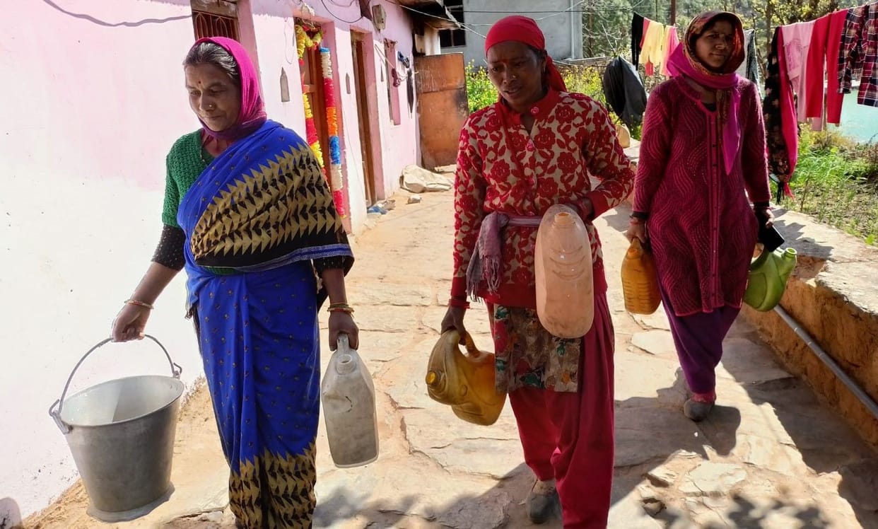 People of Annagoli village carrying water from a kilometer away