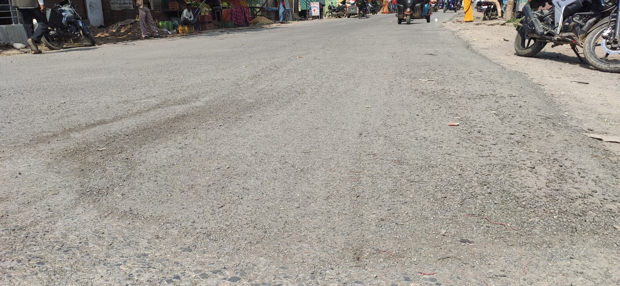 Road being built from one side, crumbling road on the other side