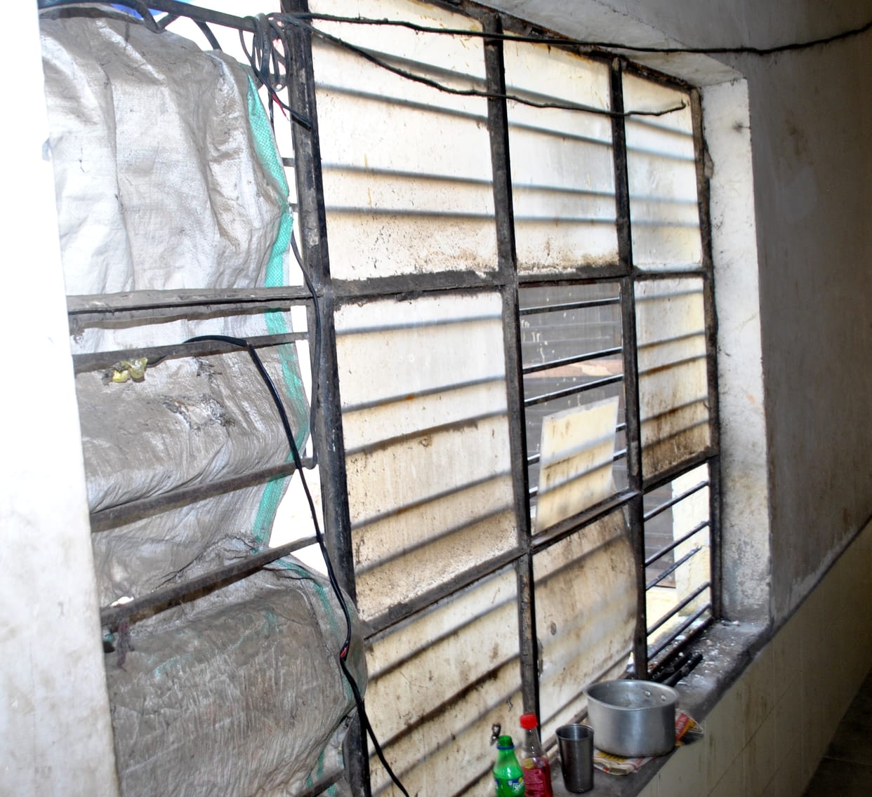 Plaster falling from the roof of the hostel, window also broken