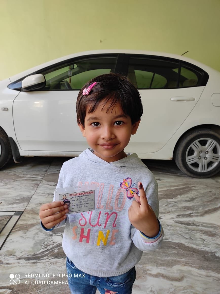 Four-year-old Satvika reached the booth with school I card