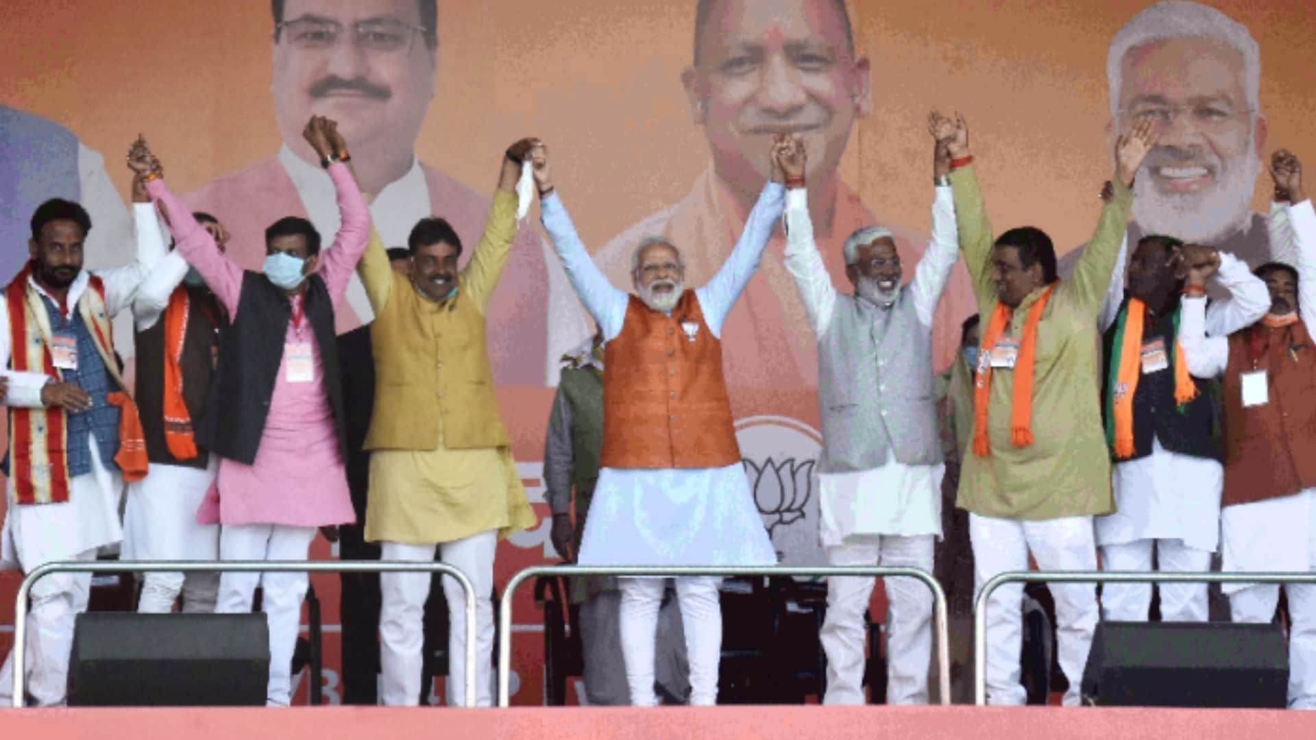 UP Election 2022 PM modi in Unnao rally touches feet of district president of BJP know the reason video goes viral