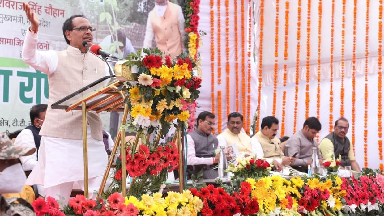 Due to lack of chair on the stage in the plantation program, the Home Minister got angry and sat behind the public