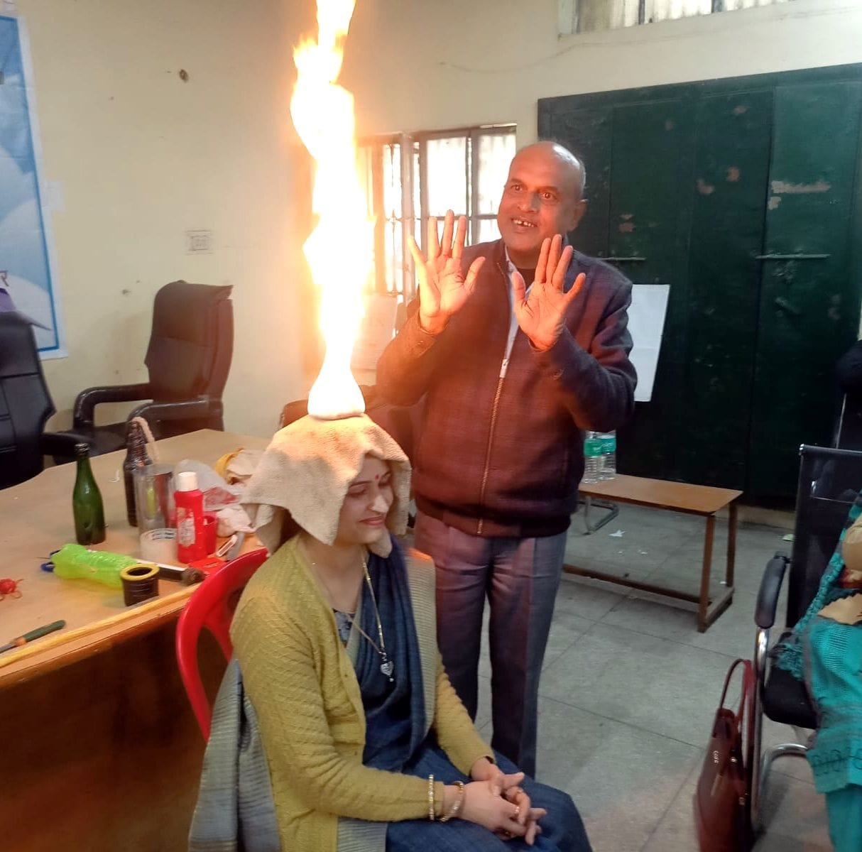 Burning camphor kept in mouth, set fire to teacher's head