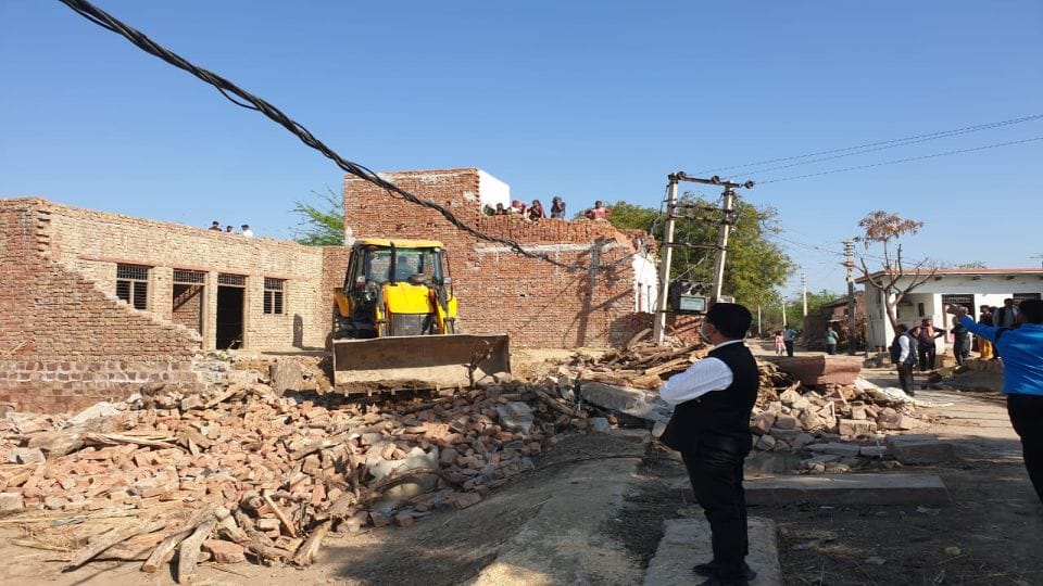 Illegal construction on school land was demolished by bulldozer in agra