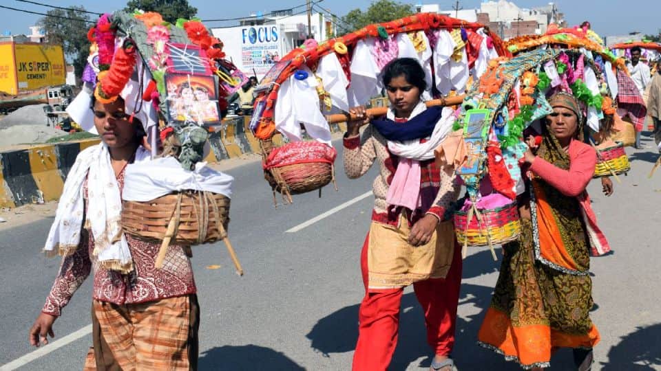 kanwariyas gathering at ganga ghats in kanwar mela kasganj