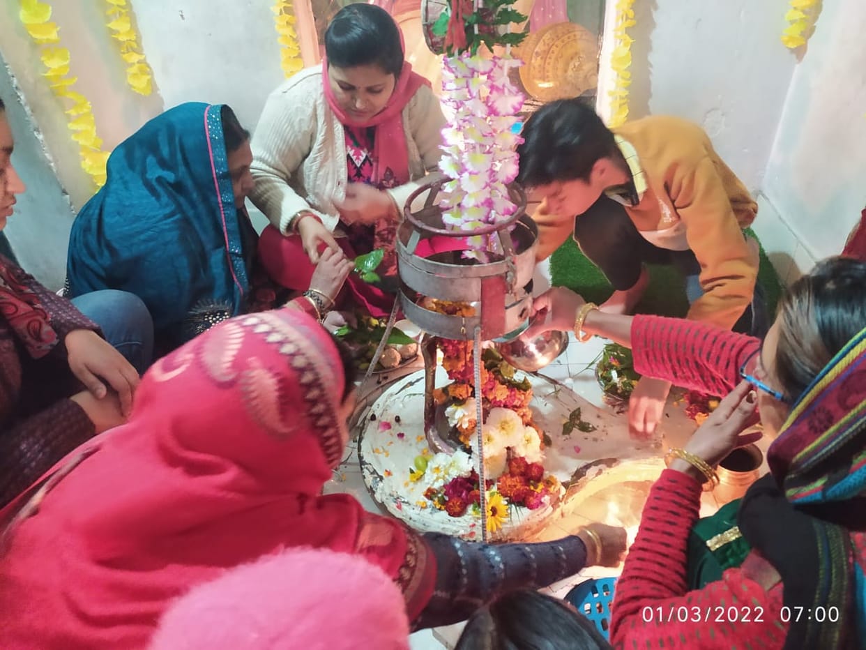 Offering pumpkin and jaggery bhel to Lord Bholenath