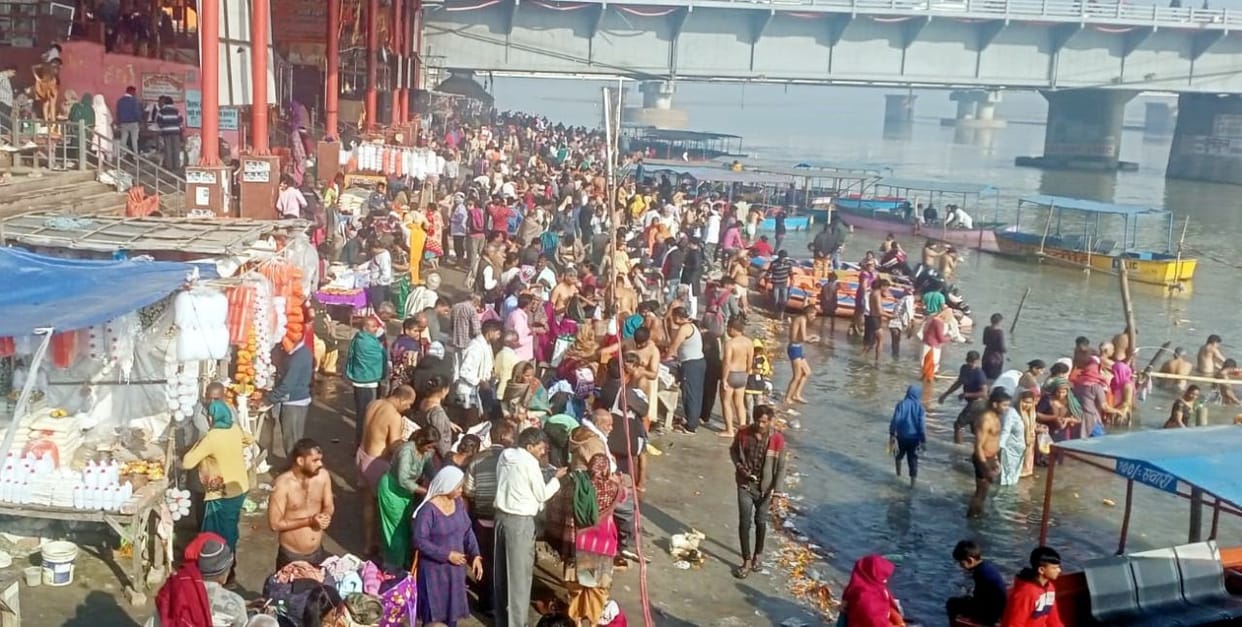 Devotees take a dip in the Ganges on Falgun Amavasya