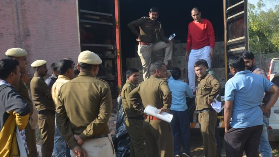 Two people fled leaving container full of liquor bottles in Charkhi Dadri