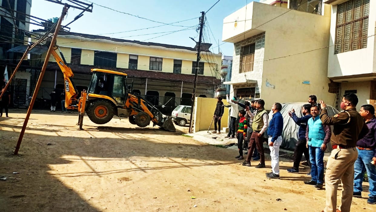 Municipality removed tin shed from JCB
