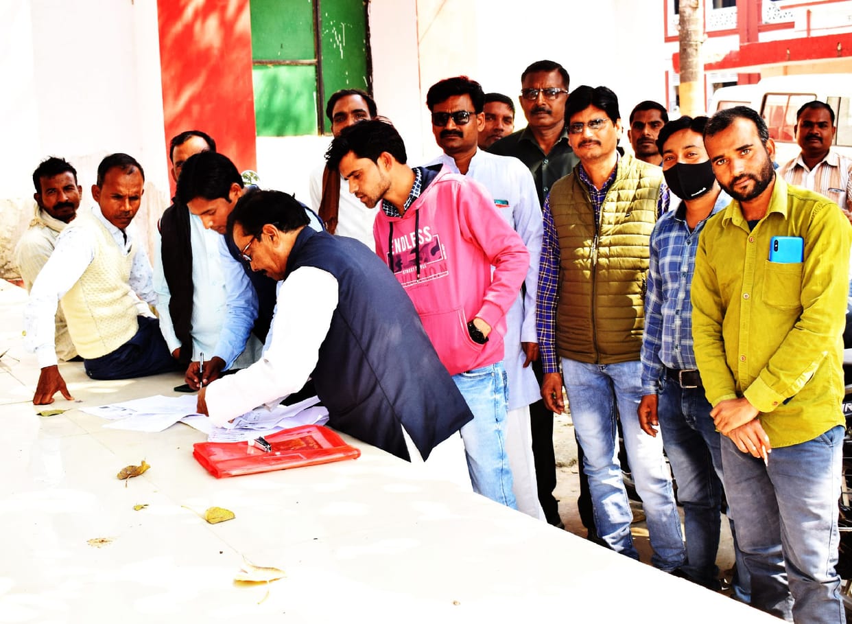 Employees engaged in getting vote counting passes, supporters of candidates