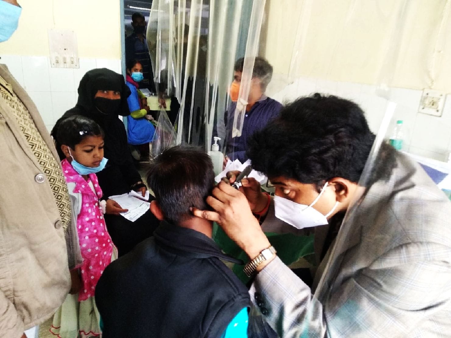 Hearing impaired children are using earphones