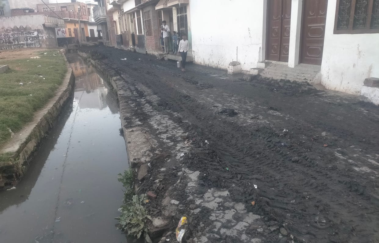 Removed the silt from the drain and cast it in front of the houses