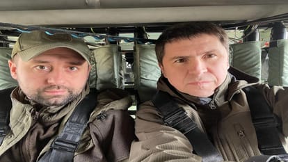 russia ukraine war ukrainian negotiator and presidential adviser mikhailo podolyak tweeted a picture of the delegations at a conference table, the ukrainians wore battle fatigues and winter jackets, the russians wore suits and ties