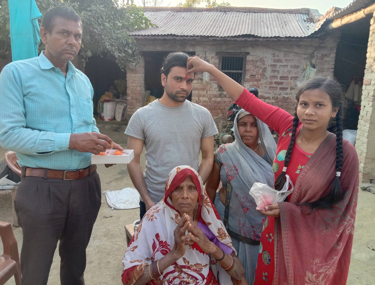 Vipin was welcomed home by his sister with a tilak