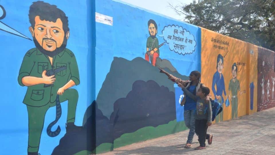 painting of Gabbar and film actors on walls making people aware about cleanliness in agra