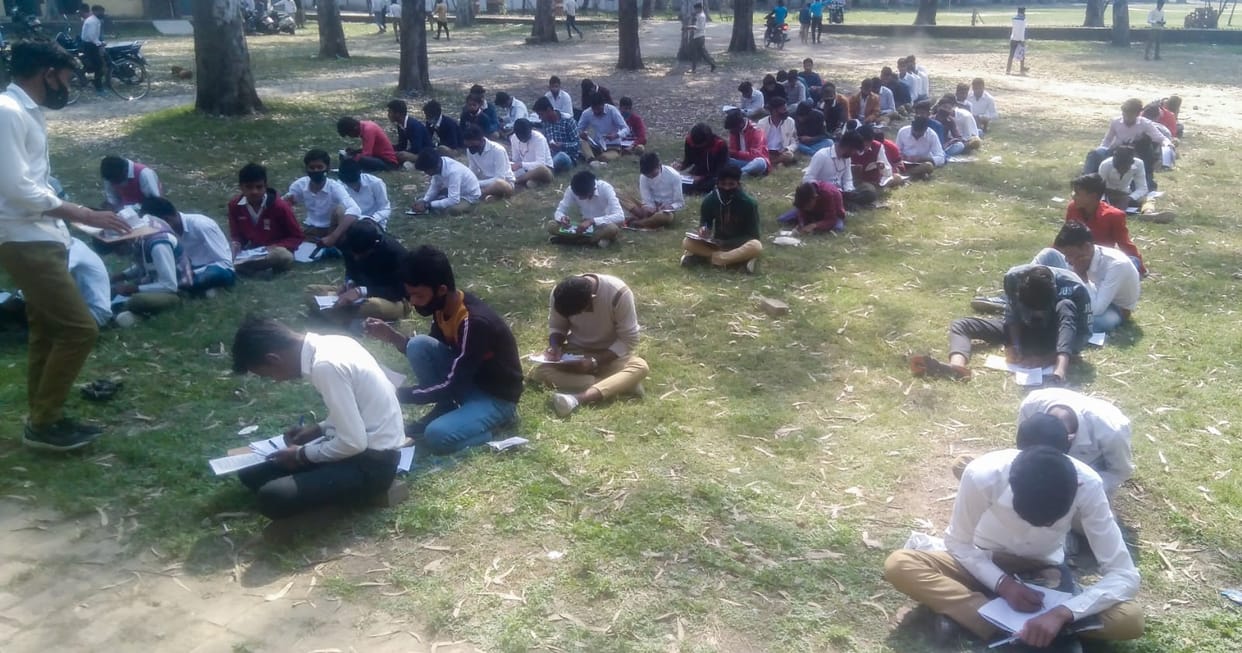 Students got the exam done by sitting on the ground