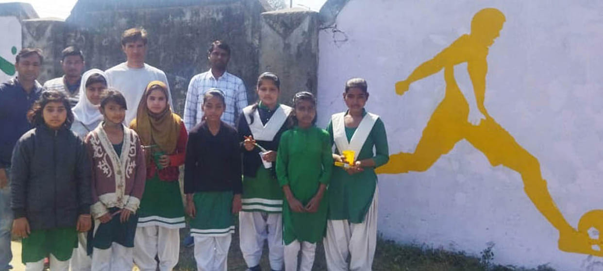 Girl students showed talent in college wall painting