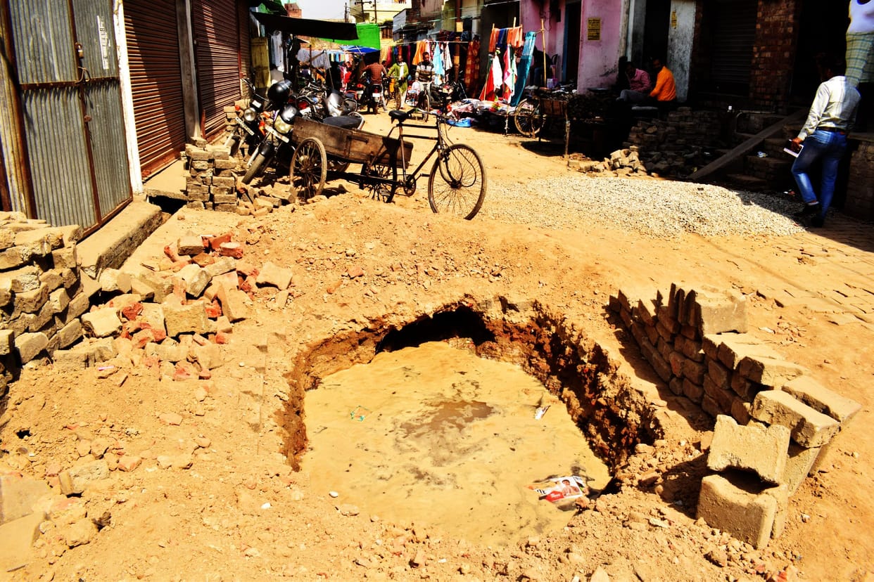 Broken water pipeline digging for sewer line